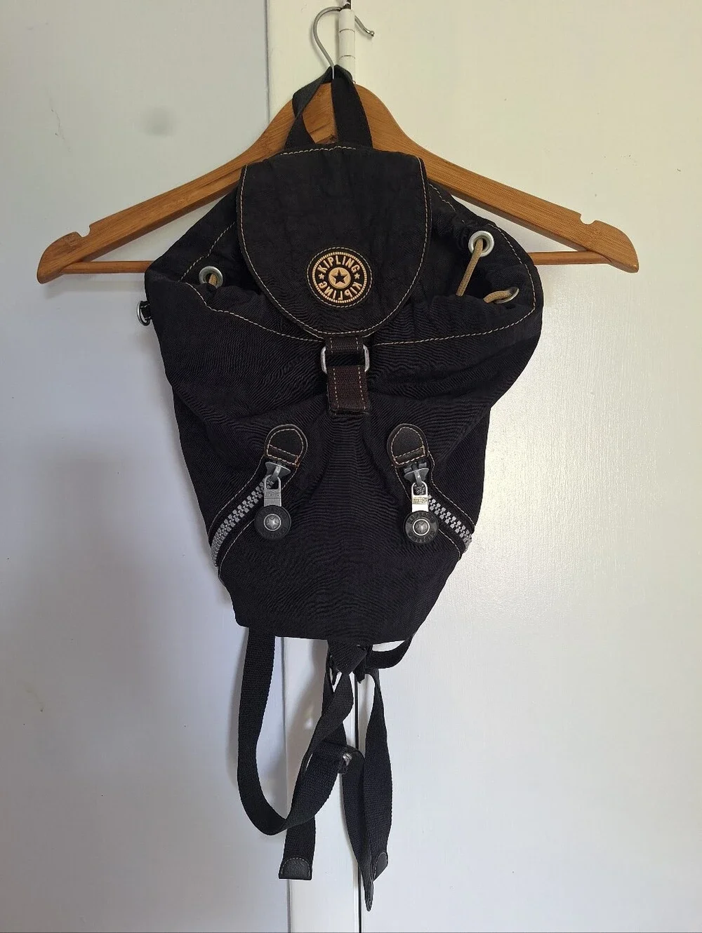 Kipling Black Canvas Drawstring Backpack with Handle And Front Zip Pockets